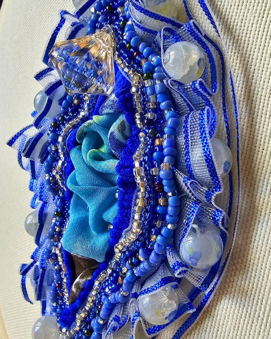 Premium seed beads, translucent/opalescent quartz-style beads, metallic-edged mesh, satin ribbons, draped fabric center, cotton canvas backdrop.