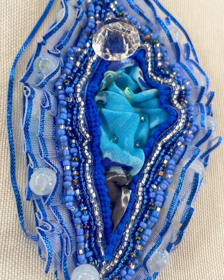 Premium seed beads, translucent/opalescent quartz-style beads, metallic-edged mesh, satin ribbons, draped fabric center, cotton canvas backdrop.