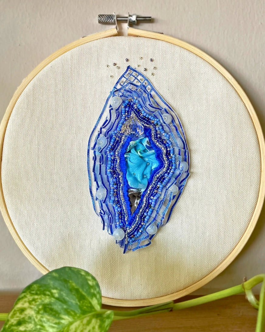 Natural wooden embroidery hoop with silver-tone hardware (ready to hang or display on a shelf).